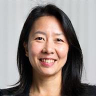 Headshot of Mei Sato, a smiling woman with medium-length dark hair.